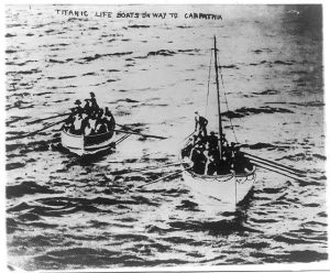 Survivors from the Titanic row towards the Carpathia